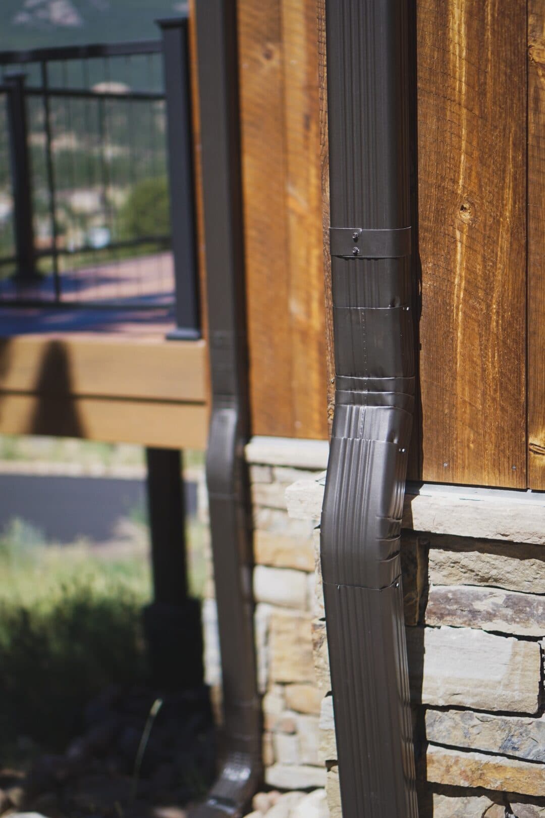 Close-up detail of a crimped and fastened downspout seam on a Colorado foothills home installed by Green Brothers Gutters.